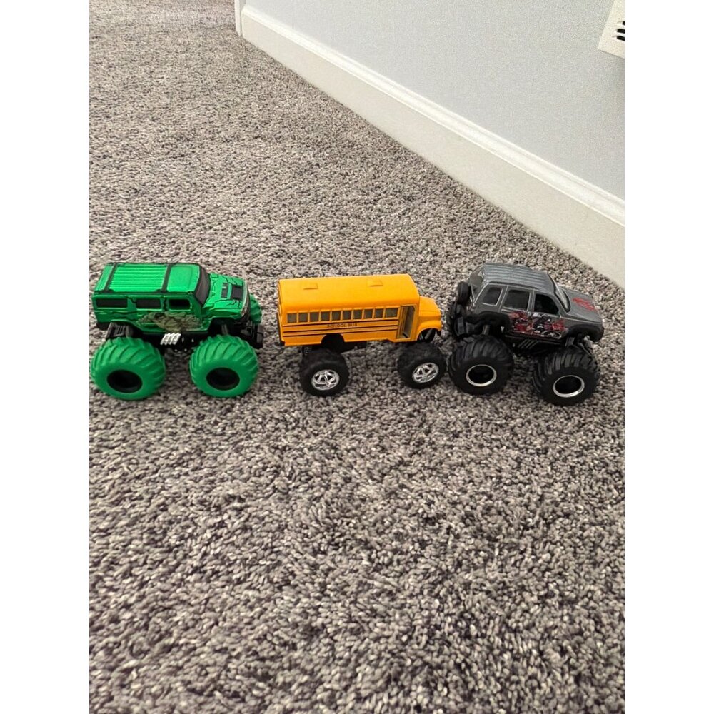 MONSTER TRUCKS LOT OF THREE VARIOUS TRUCKS BUS